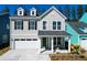 Charming two-story home featuring board and batten and lap siding, a welcoming front porch, and an attached garage at 1050 Marsh Harrier Dr # Cc3-15-3P, Ravenel, SC 29470