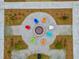 Birds eye view of community fire pit surrounded by colorful Adirondack chairs and landscaped grounds at 1050 Marsh Harrier Dr # Cc3-15-3P, Ravenel, SC 29470