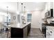 Spacious kitchen with an island, stainless steel appliances, granite countertops, and a view to the dining room at 1050 Marsh Harrier Dr # Cc3-15-3P, Ravenel, SC 29470