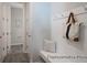 Functional mudroom features coat hooks, bench, and access to adjacent rooms at 1050 Marsh Harrier Dr # Cc3-15-3P, Ravenel, SC 29470