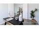 Stylish home office space with modern decor, desk, and natural light from nearby opening to the dining area at 1050 Marsh Harrier Dr # Cc3-15-3P, Ravenel, SC 29470