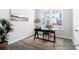 Cozy home office featuring a desk, chair, rug and natural light from the large windows overlooking the front yard at 1050 Marsh Harrier Dr # Cc3-15-3P, Ravenel, SC 29470