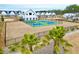 A beautiful view of a pickleball court and palms with community houses in the background at 1050 Marsh Harrier Dr # Cc3-15-3P, Ravenel, SC 29470