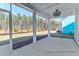 Covered porch overlooking lush backyard and wooded area at 1050 Marsh Harrier Dr # Cc3-15-3P, Ravenel, SC 29470