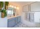 Stylish bathroom featuring dual sinks, gray cabinetry, and decorative wall art at 1054 Marsh Harrier Dr # Cc3-15-5P, Ravenel, SC 29470