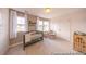 Cozy Bedroom with a crib, rocker, and natural light streaming through the windows at 1054 Marsh Harrier Dr # Cc3-15-5P, Ravenel, SC 29470