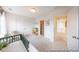 Bright Bedroom featuring a crib, changing table, and doorway to the bathroom at 1054 Marsh Harrier Dr # Cc3-15-5P, Ravenel, SC 29470