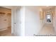 Bright hallway leading to various rooms, featuring clean lines and a neutral color palette at 1054 Marsh Harrier Dr # Cc3-15-5P, Ravenel, SC 29470