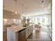 Beautiful kitchen with a large island, pendant lights, and stainless steel dishwasher, perfect for entertaining at 1054 Marsh Harrier Dr # Cc3-15-5P, Ravenel, SC 29470