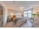 Inviting bedroom with patterned wallpaper, natural light, and ensuite bathroom at 1054 Marsh Harrier Dr # Cc3-15-5P, Ravenel, SC 29470