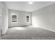 This large bedroom has neutral walls, plush carpet, and natural light at 1056 Marsh Harrier Dr # Cc3-15-6P, Ravenel, SC 29470