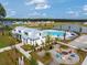 A beautiful community area with colorful adirondack chairs around the fire pit and community pool at 1056 Marsh Harrier Dr # Cc3-15-6P, Ravenel, SC 29470