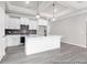 Modern kitchen with white cabinets, stainless appliances, and island at 1056 Marsh Harrier Dr # Cc3-15-6P, Ravenel, SC 29470