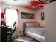 Bedroom featuring a cozy bed, a desk, and a bright window at 106 Harriet Tubman Ln, Moncks Corner, SC 29461