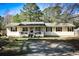 Charming single-story home featuring a cozy front porch and classic curb appeal at 106 Harriet Tubman Ln, Moncks Corner, SC 29461