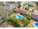Aerial view of a brick home featuring a large swimming pool and spacious backyard with a deck at 1060 Yeamans Hall Rd, Hanahan, SC 29410