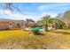 Home's backyard featuring a private pool, wooden deck, and beautiful landscaping at 1060 Yeamans Hall Rd, Hanahan, SC 29410