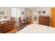 Inviting bedroom with hardwood floors, dresser, and ensuite bathroom at 1060 Yeamans Hall Rd, Hanahan, SC 29410