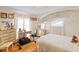 Comfortable bedroom with a canopy bed, hardwood floors, and plenty of natural light at 1060 Yeamans Hall Rd, Hanahan, SC 29410