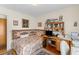 Cozy bedroom with a patterned bedspread, wooden desk, and ample shelving at 1060 Yeamans Hall Rd, Hanahan, SC 29410