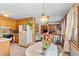 Bright dining area featuring a view into the living room and an adjacent kitchen for easy entertaining at 1060 Yeamans Hall Rd, Hanahan, SC 29410