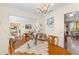 Bright dining area featuring a chandelier and views into the living area at 1060 Yeamans Hall Rd, Hanahan, SC 29410