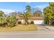 Well-maintained brick house with mature landscaping, featuring a two-car garage at 1060 Yeamans Hall Rd, Hanahan, SC 29410