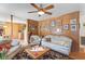 Cozy living room with wood paneling, comfortable seating, and access to the kitchen at 1060 Yeamans Hall Rd, Hanahan, SC 29410