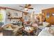 Cozy living room with fireplace, ceiling fan, and a large area rug, perfect for Gathering gatherings at 1060 Yeamans Hall Rd, Hanahan, SC 29410