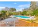 Inviting backyard oasis with a pool, deck, lounge chairs, and beautiful landscaping at 1060 Yeamans Hall Rd, Hanahan, SC 29410