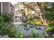 Inviting backyard with fire pit and Adirondack chairs, perfect for outdoor entertaining and relaxation at 118 Freeman St, Mount Pleasant, SC 29464