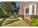 Lush backyard featuring manicured lawn, brick accents and mature landscaping, perfect for outdoor enjoyment at 118 Freeman St, Mount Pleasant, SC 29464