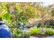 Backyard with fire pit and Adirondack chairs surrounded by lush landscaping, perfect for relaxation at 118 Freeman St, Mount Pleasant, SC 29464