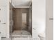 Bathroom featuring a tile shower with glass door and modern fixtures at 118 Freeman St, Mount Pleasant, SC 29464