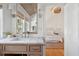 Bright bathroom with wood ceiling and marble countertops open to the bedroom at 118 Freeman St, Mount Pleasant, SC 29464