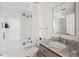 Bathroom features a tub with a glass shower door, marble vanity, and modern fixtures at 118 Freeman St, Mount Pleasant, SC 29464