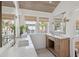 Bright bathroom with marble countertops, wooden vanity, and large windows at 118 Freeman St, Mount Pleasant, SC 29464