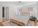 Bright bedroom with hardwood floors, window lighting, and neutral decor at 118 Freeman St, Mount Pleasant, SC 29464