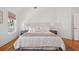 Bright and airy bedroom featuring a large bed, with bedside tables on either side at 118 Freeman St, Mount Pleasant, SC 29464