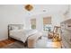 Bright bedroom with hardwood floors, window lighting, and modern decor at 118 Freeman St, Mount Pleasant, SC 29464