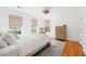 Bright bedroom with hardwood floors, window lighting, and chest of drawers at 118 Freeman St, Mount Pleasant, SC 29464