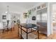 Cozy dining room with a marble table, seating for four, and views into the living room at 118 Freeman St, Mount Pleasant, SC 29464