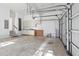 Spacious garage with storage cabinets and open layout, perfect for parking and projects at 118 Freeman St, Mount Pleasant, SC 29464