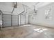 Clean and organized garage featuring multiple garage doors and ample space for vehicles and storage at 118 Freeman St, Mount Pleasant, SC 29464