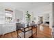 Bright, open kitchen features stainless steel appliances, island with seating, and hardwood floors at 118 Freeman St, Mount Pleasant, SC 29464