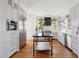 Open kitchen layout with large island, stainless appliances, and custom cabinets at 118 Freeman St, Mount Pleasant, SC 29464
