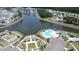 Aerial view of community with pool, water views and surrounding neighborhood at 125 Leeward Landing, Summerville, SC 29486