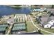 An aerial view of a community with tennis courts and bocce ball near a lake at 125 Leeward Landing, Summerville, SC 29486