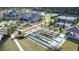 Aerial view of bocce ball courts and other community amenities near a lake at 125 Leeward Landing, Summerville, SC 29486