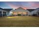 Spacious backyard featuring a screened-in porch, perfect for outdoor relaxation and entertainment at 125 Leeward Landing, Summerville, SC 29486